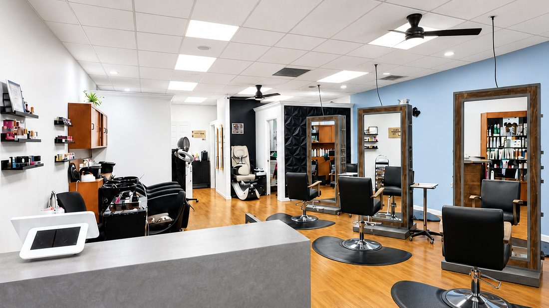 Inside Serendipity Hair Studio: front desk, styling chairs, shampoo bowls and the nail station