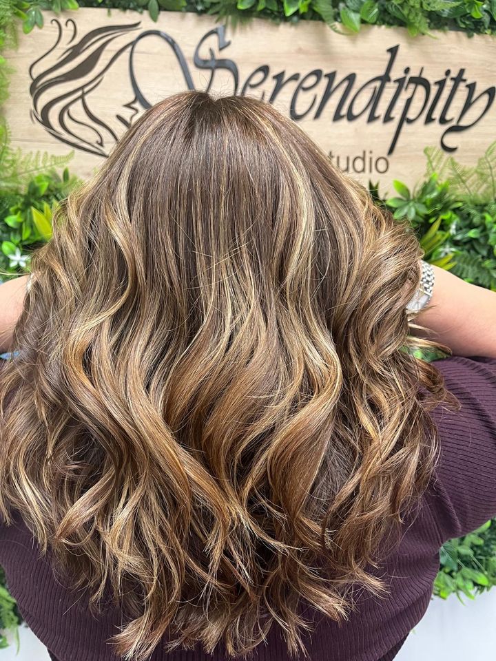 Dimensional balayage waves in front of the Serendipity sign in Cape Coral
