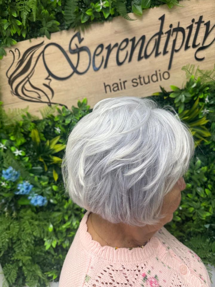 Silver pixie cut by the Serendipity sign