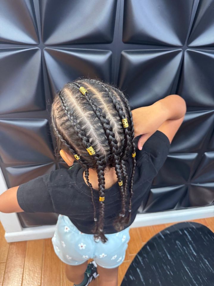 Braids with gold cuffs, seen from behind