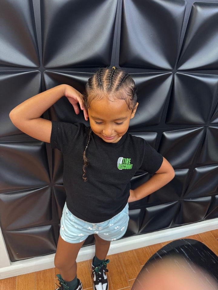 Happy kid showing off new braids